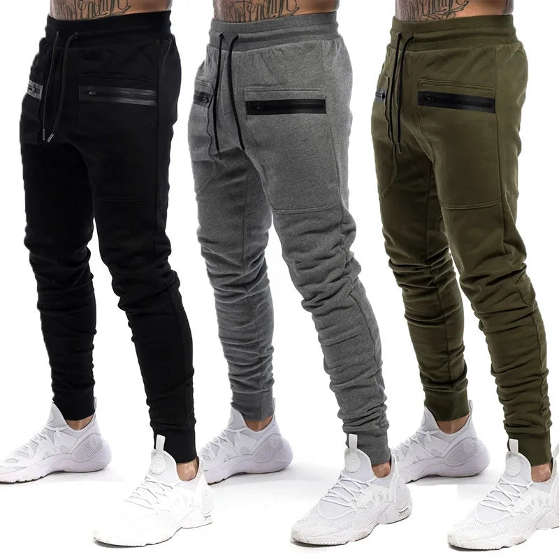 Calça Moletom Fitness Masculina Marcanzzi MZ315 em algodão premium, com cintura ajustável, bolsos com zíper e design moderno para treinos e casual.