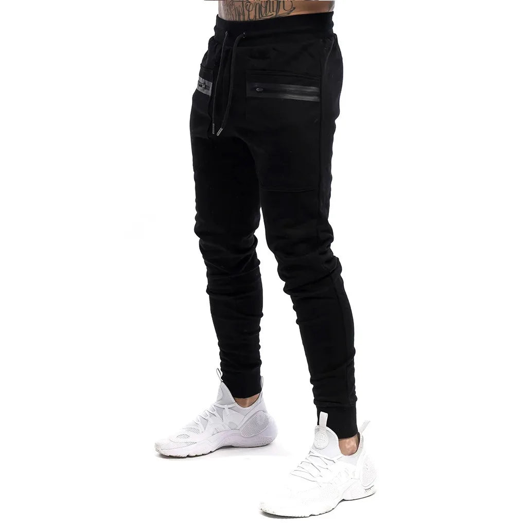 Calça Moletom Fitness Masculina Marcanzzi MZ315 em algodão premium, com cintura ajustável, bolsos com zíper e design moderno para treinos e casual.