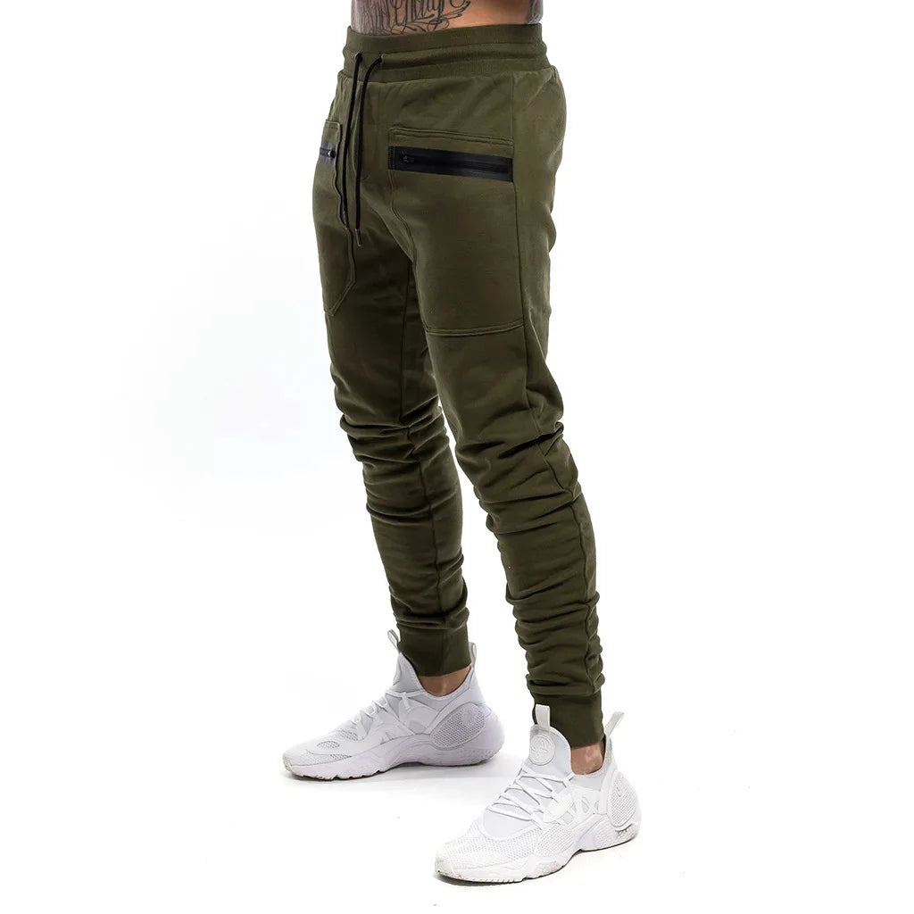 Calça Moletom Fitness Masculina Marcanzzi MZ315 em algodão premium, com cintura ajustável, bolsos com zíper e design moderno para treinos e casual.