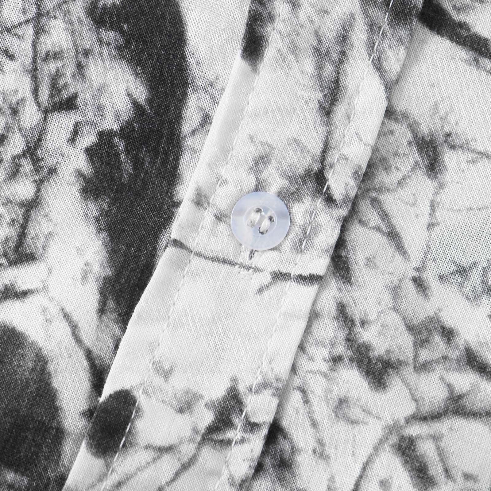 Camisa Manga Curta Estampada Marcanzzi Floral MZ569 branca com estampa floral preta, tecido leve e respirável, caimento confortável e moderno.