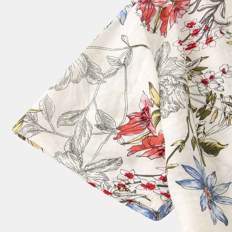 Camisa Manga Curta Marcanzzi Verona MZ591 com estampa floral em verde, azul e vermelho sobre fundo claro, tecido leve, fresco e confortável.