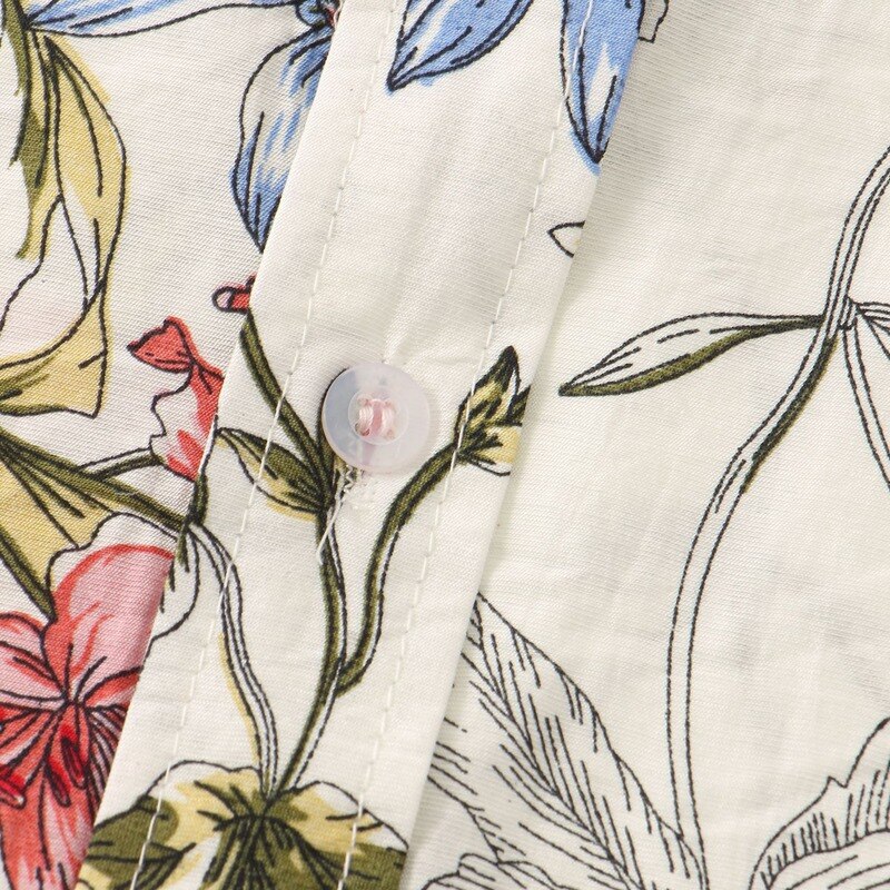 Camisa Manga Curta Marcanzzi Verona MZ591 com estampa floral em verde, azul e vermelho sobre fundo claro, tecido leve, fresco e confortável.