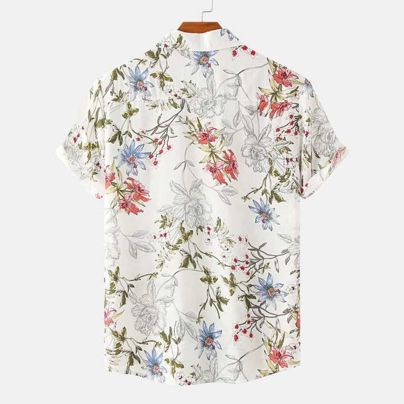 Camisa Manga Curta Marcanzzi Verona MZ591 com estampa floral em verde, azul e vermelho sobre fundo claro, tecido leve, fresco e confortável.