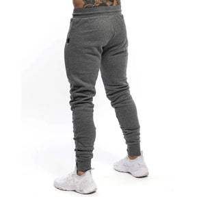 Calça Moletom Fitness Masculina Marcanzzi MZ315 em algodão premium, com cintura ajustável, bolsos com zíper e design moderno para treinos e casual.
