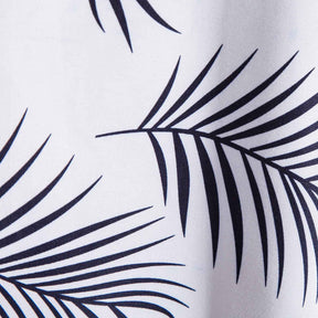 Camisa Manga Curta Marcanzzi Ipanema MZ579 branca com estampa tropical de folhas pretas, tecido leve e respirável, caimento confortável e moderno.